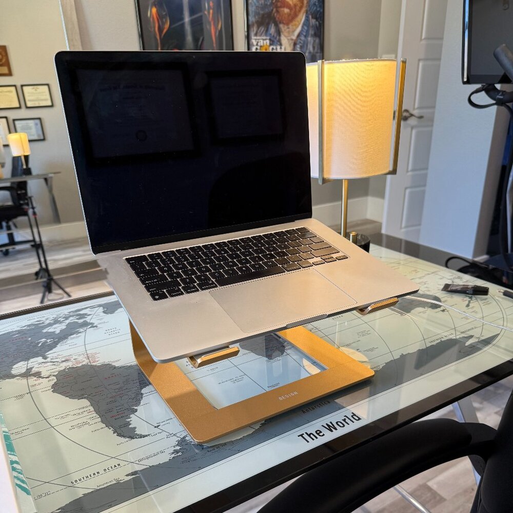 Gold Laptop Stand, brand new, easy to assemble. Will ship in 24 hours.
